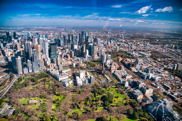 Canvas Print - MELBOURNE, AUSTRALIA - SEPTEMBER 8, 2018: Aerial city skyline from helicopter. Downtown skyscrapers and park.