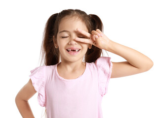 Canvas Print - Adorable little girl in pink dress showing victory gesture on white background