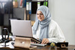 © Andrey Popov - Woman Wearing Hijab In Virtual Interview Meeting