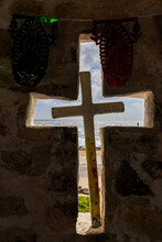 Catholic Cross Outside On A Troical Island Beach As Seen Through Cross Carved In Wall. 
