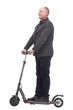 © ASDF - happy casual man with electric scooter .isolated on a white background.