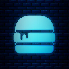 Poster - Glowing neon Burger icon isolated on brick wall background. Hamburger icon. Cheeseburger sandwich sign. Fast food menu. Vector