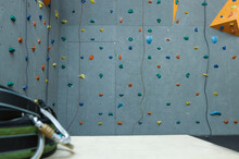 Wall With Holds And Climbing Ropes In Gym