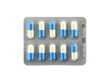 Package Of Blue And White Capsule Pills Isolated On White Background, Antibiotic Medicine In Aluminium Blister Foil Packaging With Expiration Date, Pharmaceutical Industry