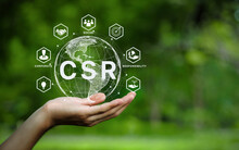 CSR Icon Concept In The Hand For Business And Organization, Corporate Social Responsibility And Giving Back To The Community On A Green Nature Background.