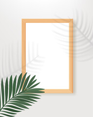 Poster - Empty wood frame on the table with palm leaves shadows. 3d vertical vector mockup for design