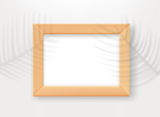 Poster - Empty wood frame on the table with palm leaves shadows. 3d vector mockup for design