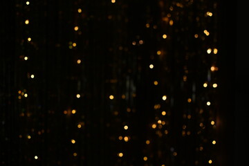 gold glitter backdrop. falling golden lights. Magic and luxury party background design or Christmas 