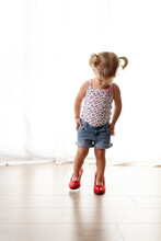 Cute Toddler Girl Wearing Mother's High Heels