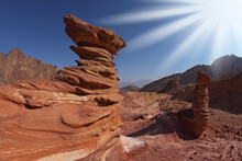 The Sparkling Sun Above Interesting Natural Forms Of Sandstone Hoodoos