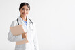 © Prostock-studio - Friendly young cute indian female doctor in uniform with tablet in hands looking at camera isolated on white background