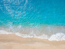 A Background Or Texture Of Turquoise Sea And Waves At A Beach