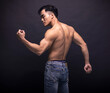 © Tom Wang - Rear view of  muscular asian young man