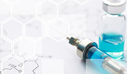 Wall Mural - small jars with injection and syringe for injection on a blue background near the chemical formula