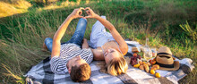 Couple In Love On A Picnic In The Park. Selective Focus