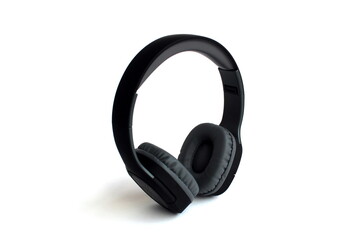 Black headphones are on a white isolated background.