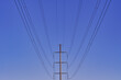 Electricity pylon against the sky. High - voltage power lines .