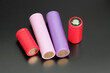 Batteries on dark background. Lithium ion cells, rechargeable electronic cigarette batteries