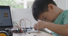 Small kid children make coding scratch car upskill STEAM lifestyle.