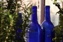 Blue Glass Bottle Decorations In The Window