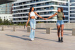 © Raul Mellado - young girls strolling by the city holding hands