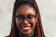 © Raul Mellado - portrait of young black woman with glasses smiling