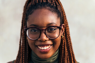 portrait of young black woman with glasses smiling