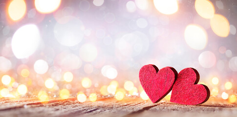 Wall Mural - valentine's day - wooden hearts with defocused blurred lights