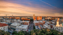 Aerial View Of Savannah Historic District In Georgia Before Sunset With A Few High Rise Buildings, Church Of The Ascension Of Wright Square And Bull Street