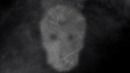 Wall Mural - smokey skull apparition background 4k loop features a smoke-filled atmosphere with the appearance of