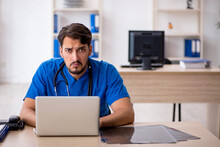 Young Male Doctor In Telemedicine Concept