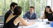 © tuiphotoengineer - businessmen and Engineer group using notebook for business partners discussing documents and ideas at meeting and business women smiling happy for working