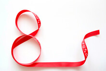 Red Gift Festive Ribbon In The Form Of 8 Numbers. Congratulations On Women's Day. Copyspace