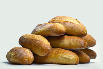 Sticker - Several crispy loaves of bread on top of each other, white background, copy space