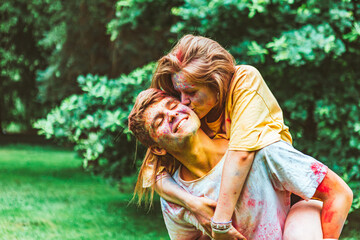 Canvas Print - young pretty couple having fun at holi fest