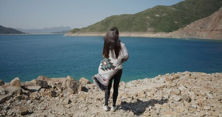 Canvas Print - Woman look at the scenery view at Hong Kong Geopark