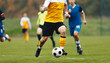 © matimix - Adult Football Players Kicking Soccer Ball. Soccer Competition Between Two Teams. Soccer League Match. Player in Football Cleats in Run