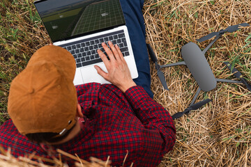 Aufkleber - Farmer with laptop and drone on the field. Smart farming and agriculture digitalization