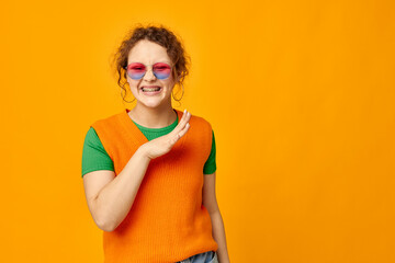 cheerful woman multicolored sunglasses on face posing grimace cropped view unaltered