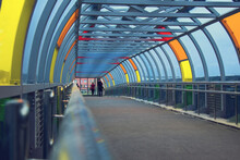 Glass Pedestrian Crossing, Overhead Passage Through The Highway. Bright Multi-colored Glass On A Metal Frame. New Moscow