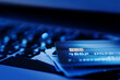 © bigy9950 - Close up shot of credit card on Laptop computer payment for purchases from online stores and online shopping. Concept of internet purchase. Blue colour tone and selective focus for background.