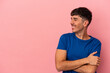 © Asier - Young mixed race man isolated on pink background smiling confident with crossed arms.