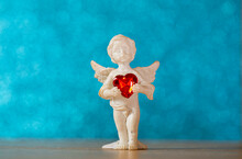 Red Heart. Love Concept. Angel Statue