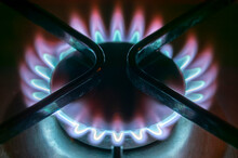 Gas Burner Cooker Stove With A Blue And Red Flame Which Is A Non Green Fossil Fuel Causing Global Warming And Environmental Damage, Close Up Stock Photo Image