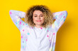 Portrait of attractive cheery dreamy wavy-haired girl in pajama drowsing relaxing isolated over vivid yellow color background