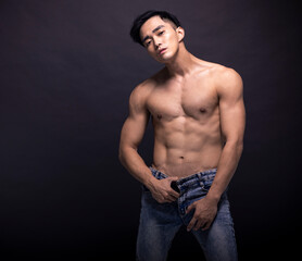 Wall Mural - Portrait of young asian bodybuilder  man.