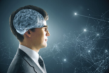 Poster - Portrait of attractive young european businessman with abstract polygonal brain on gray background. Brainstorm, AI and machine learning concept.