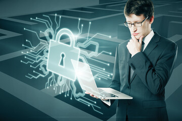 Poster - Attractive thoughtful young european businessman holding laptop with abstract padlock chip hologram on maze background, Solution, choice and protection concept. Double exposure.