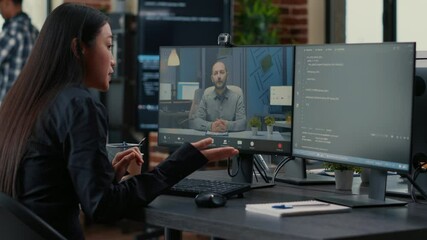Freelancer software programer in video call conference with project owner discussing coding deadline in office with team working. Programer having online chat with supervisor about source code.