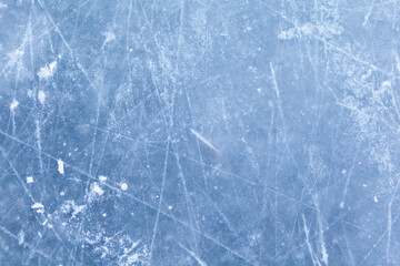 Aufkleber - Empty ice rink with skate marks after the session outdoor. skating ice rink texture covered with snow in daylight. Close up of blue ice rink floor, copy space